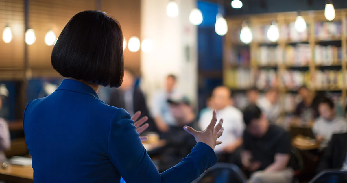 Person presenting to a crowd